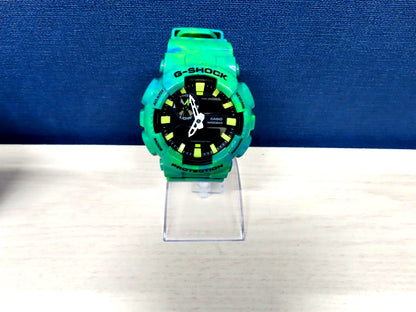 Casio G-Shock GAX-100MB green watch with digital analog display and robust shock resistant design