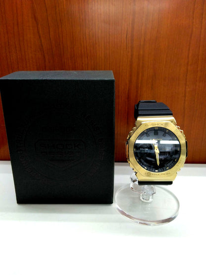 Casio G-Shock GM-2100G-1A9JF wristwatch with black and gold-tone finish in used condition