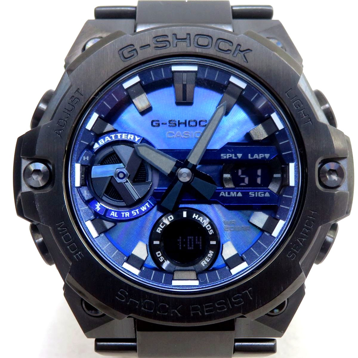 Casio G-Shock GST-B400-1A2JF solar watch with blue accents, box, and instruction manual
