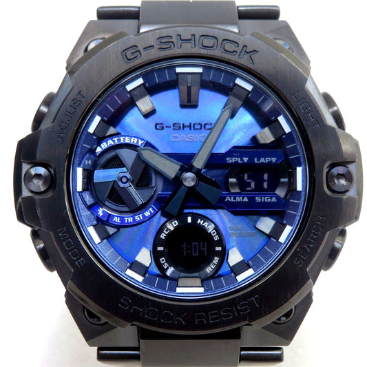 Casio G-Shock GST-B400-1A2JF solar watch with blue accents, box, and instruction manual