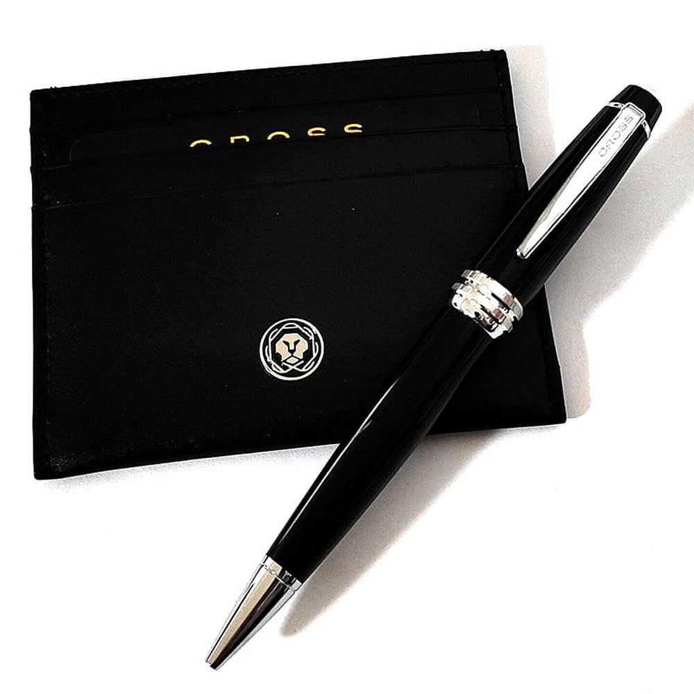 Cross Bailey black ballpoint pen with brass lacquer finish alongside matching card case and gift box
