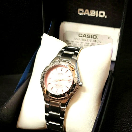 Casio LTD-1035A-4AJF analog watch with pink dial, stainless steel case, and 10 ATM water resistance
