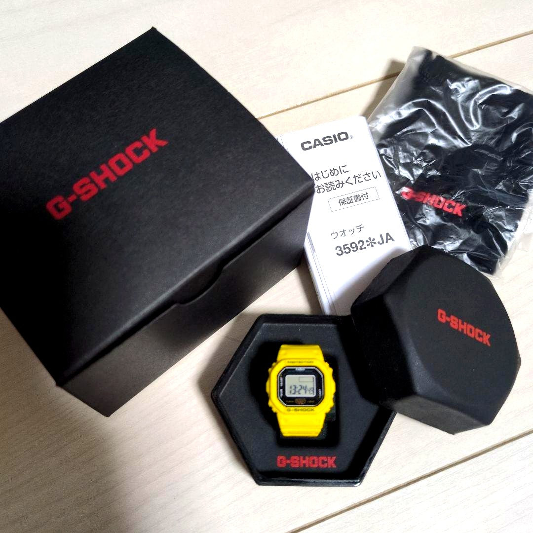 Casio G-Shock Nano DWN-5600-9JR yellow square ring watch with dedicated case and bag