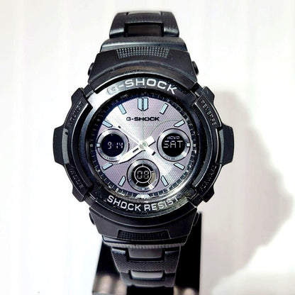 Casio G-Shock AWG-M100BC radio solar watch with metal band showing scratches and paint chipping