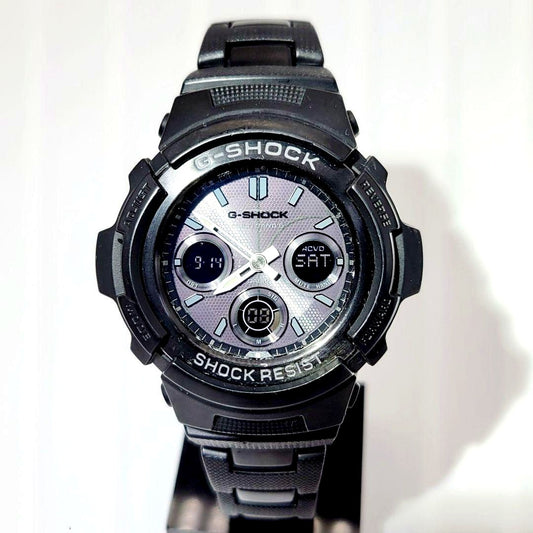 Casio G-Shock AWG-M100BC radio solar watch with metal band showing scratches and paint chipping