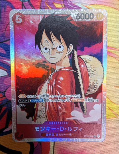 One Piece Monkey D. Luffy collectible card OP01-012 from the OP series in protective sleeve