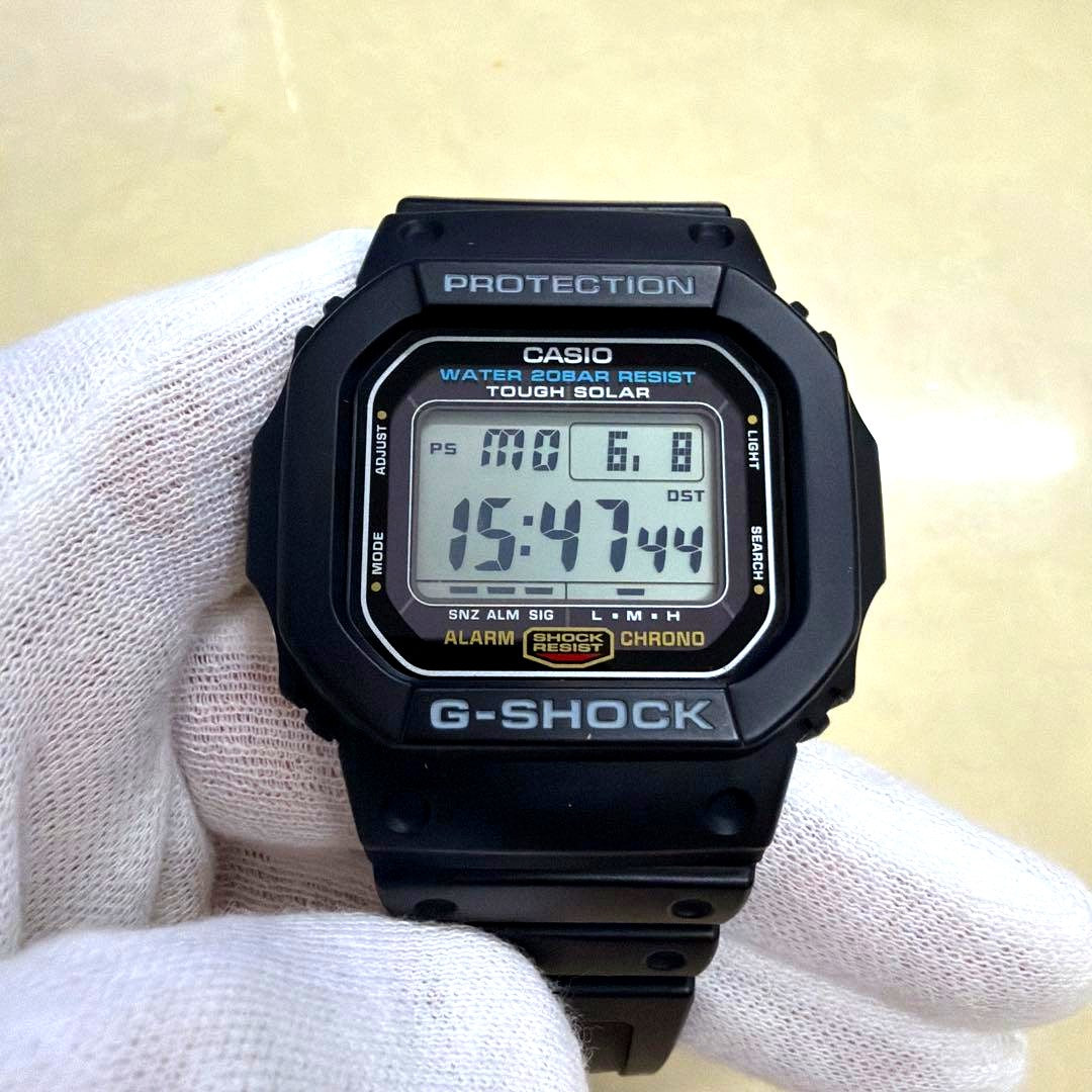 Casio G-Shock Solar 3160 G-5600E digital watch Japan import shown on black background