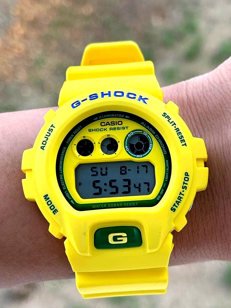Casio G-Shock yellow wristwatch with digital display and 200m water resistance