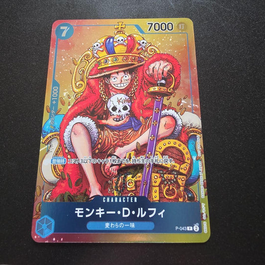 Bandai One Piece Monkey D. Luffy P-043 character card featuring Luffy with crown, Japan import