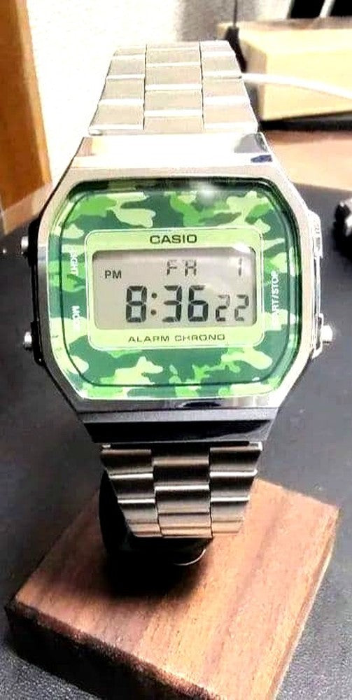 Casio A169WE camouflage digital watch with stainless steel band showing the military-style pattern and digital display