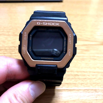 Casio G-Shock G-Lide GBX-100NS-4JF digital watch in black and rose gold with tide and moon data display