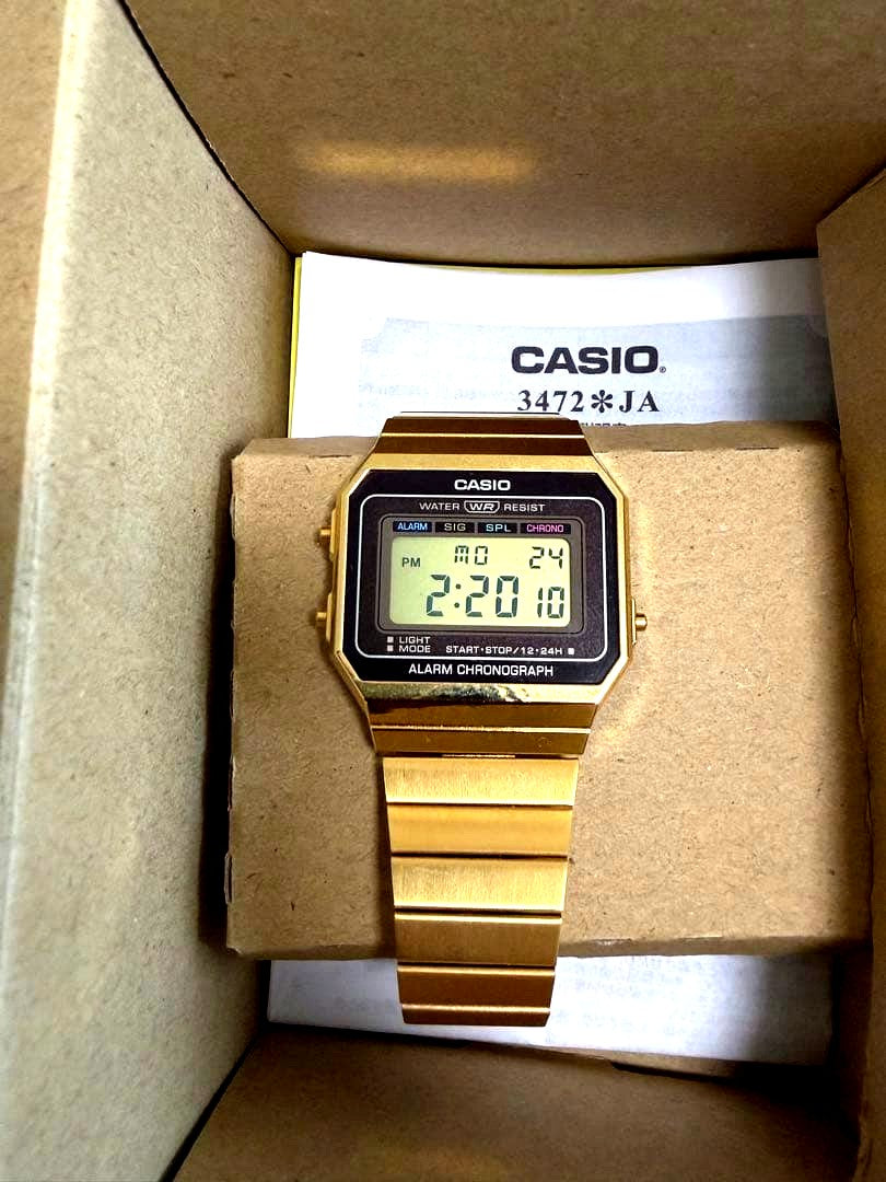 Casio gold wristwatch with original box in good working condition no scratches visible