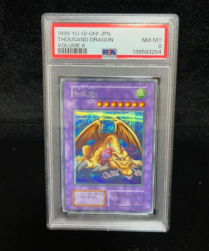 Yu-Gi-Oh PSA8 Millennium Dragon Secret Rare trading card showing Japanese import with serial number 006/165
