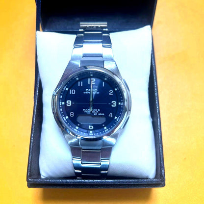 Casio Wave Ceptor watch with blue dial, silver band, solar radio-controlled, and quartz movement