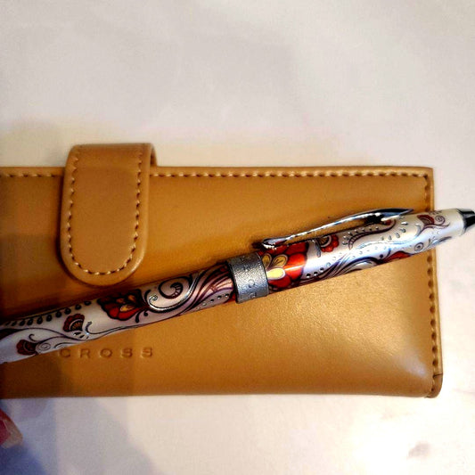 Cross ballpoint pen with paisley pattern design alongside its dedicated beige case