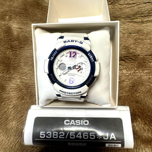 White Casio Baby-G digital watch for children, used with dead battery, shown from front view