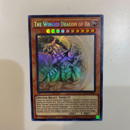 Bandai Yu-Gi-Oh Ra's Winged Dragon of Horus Ghost Rare card North America Edition in protective sleeve