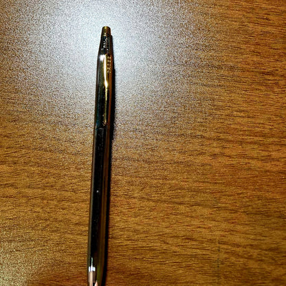 Cross Classic Century Twist Ballpoint Pen with gold and silver finish and slim silhouette