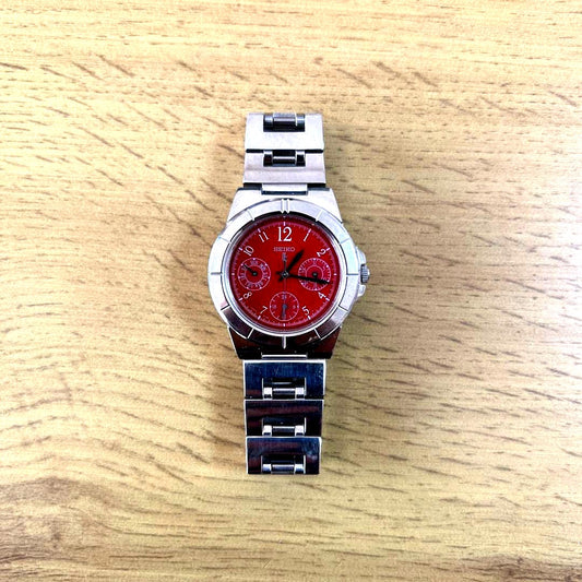 Casio Lucia ladies chronograph watch with red dial and round stainless steel case