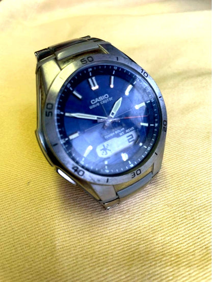 Used Casio Wave Ceptor WVA-M640 men's watch showing analog display and metal band