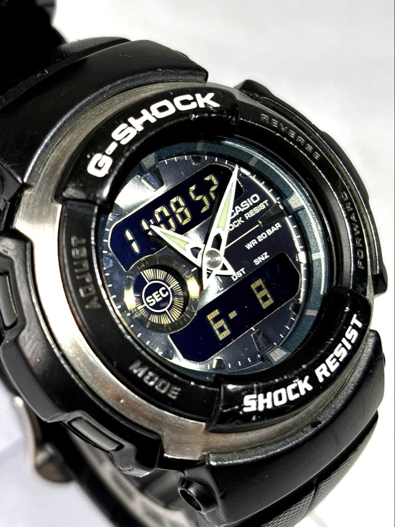 Used Casio G-Shock G-300-3AJF watch with green band and clear face showing minor wear
