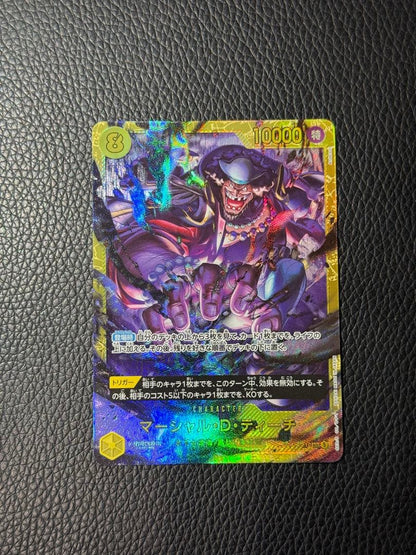 One Piece Marshall D. Teach collectible card stored in a protective sleeve displayed against white background