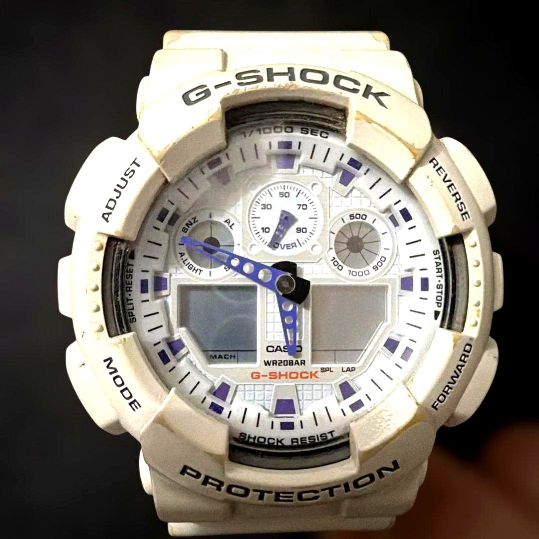 Casio G-Shock GA-100A white shockproof quartz watch with resin band and stainless steel case