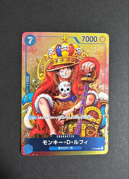 One Piece Monkey D. Luffy P-043 collectible card removed from binder with minor wear