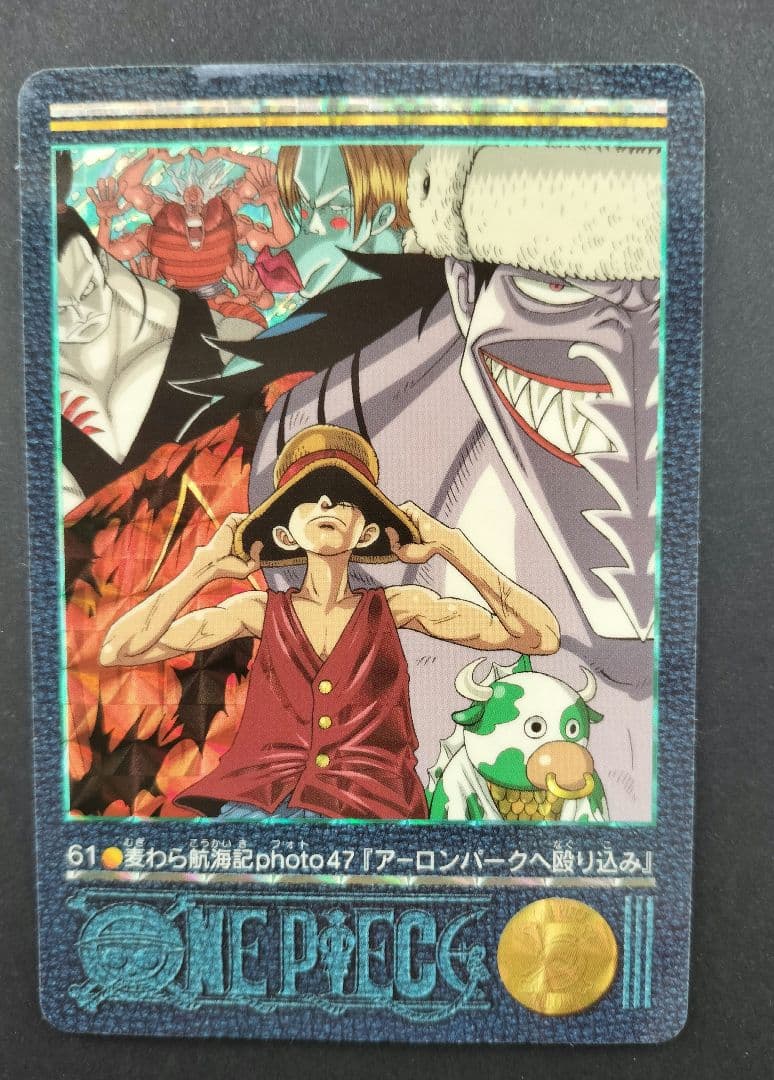 One Piece Carddass Visual Adventure 61 trading card showing Arlong Park with slight edge wear and sun fading on the back
