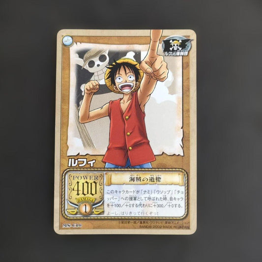 Old One Piece Monkey D. Luffy MS-C10 Pirate's Beacon trading card with signs of aging and damage
