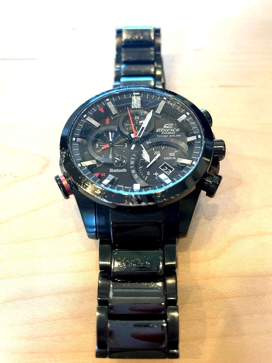 Casio Edifice EQB-500 Bluetooth solar watch with black damaged band and silver body, Japan import