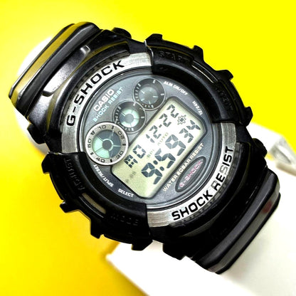 Casio G-Shock G-Lide Watch with metal and resin case, backlight on, showing time on display