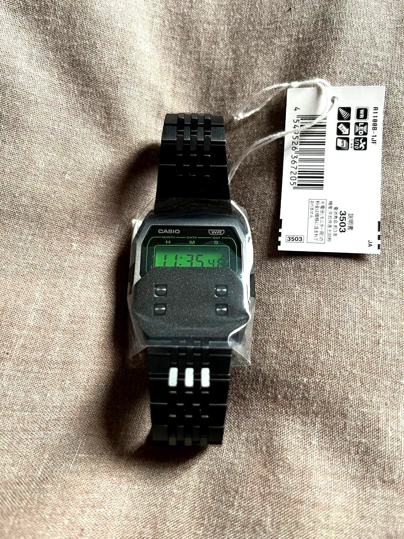 Casio A1100B-1JF premium watch with resin case, resin glass, and stainless steel band