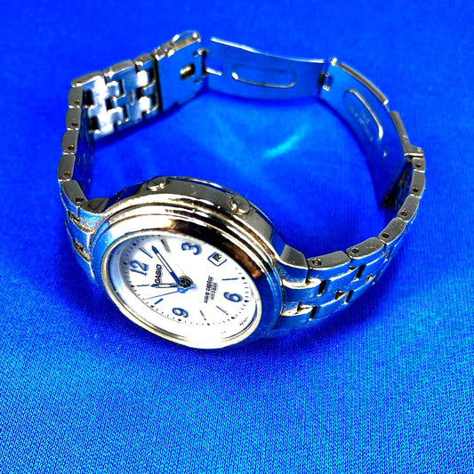 Casio Waveceptor LWQ-120 radio solar women's watch with silver metal band and visible signs of wear