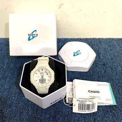Used Casio Baby-G 5556 watch with minor scratches and yellowing on the back with original box