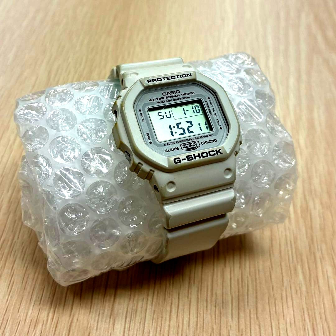 Casio G-Shock Digital Square Watch in white with electro-luminescent backlight and shock-resistant design