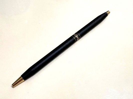 Cross Twist slender black ballpoint pen with matte finish and gold leaf-pattern ring detail