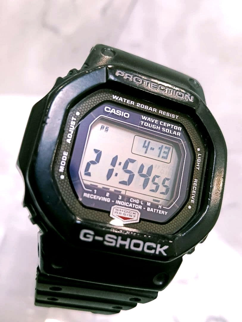 Casio G-Shock GW-5600J solar radio watch showing digital display and black resin strap