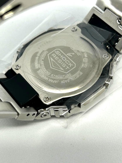 Casio G-Shock GM-2110D-2BJF analog-digital watch with navy dial and silver case on white background