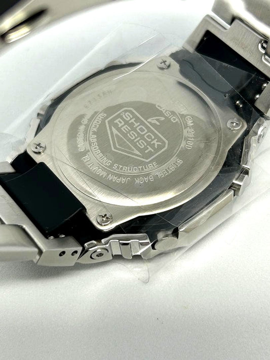 Casio G-Shock GM-2110D-2BJF analog-digital watch with navy dial and silver case on white background