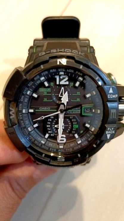 Casio G-Shock GA-100 black rubber band watch with 200m water resistance and stopwatch features