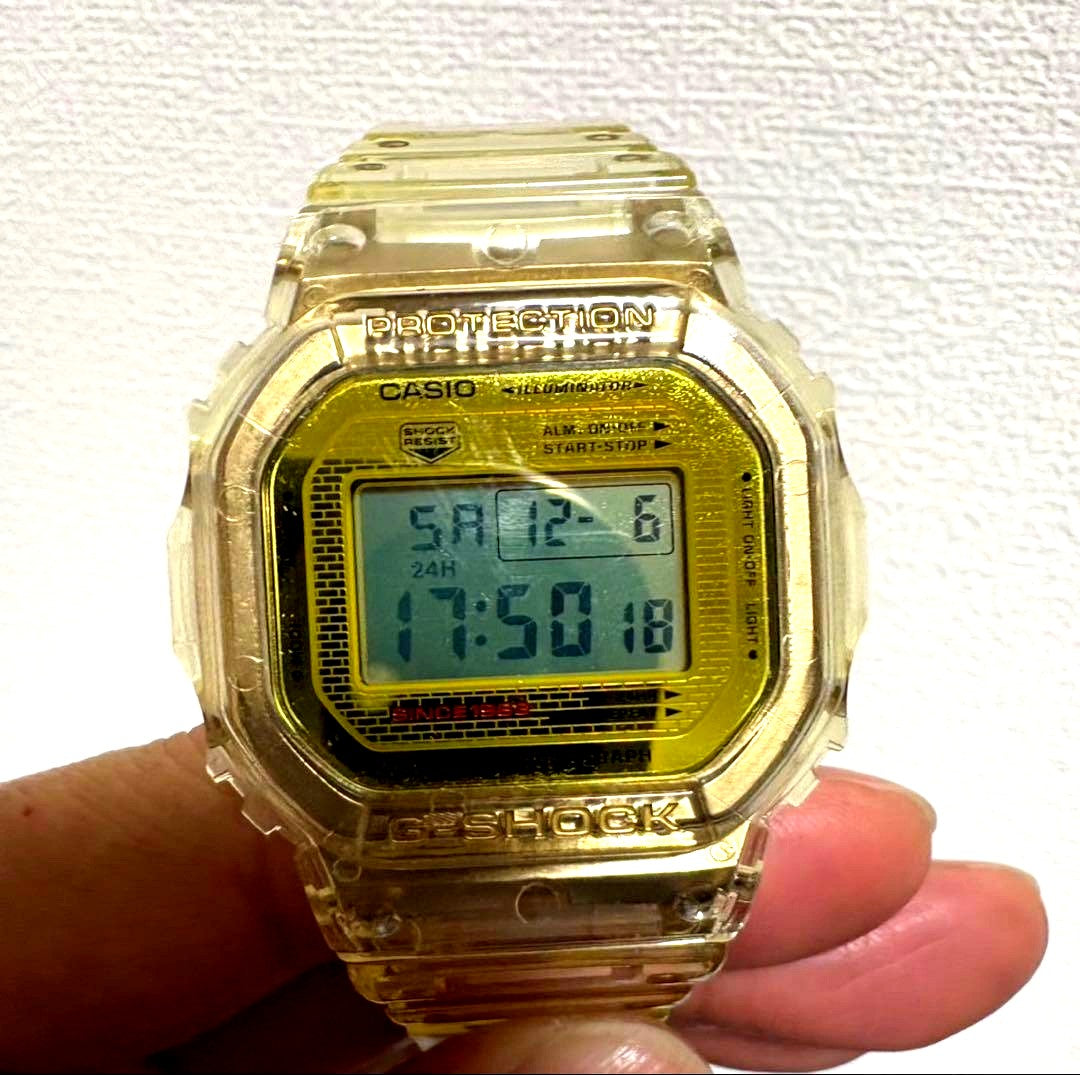 Casio G-Shock DW-5600 Limited Gold Skeleton Collaboration Watch showing gold transparent design and digital display