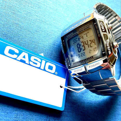 Casio Digital Watch QX81602 with silver case, stainless steel band, and 13-language data bank feature