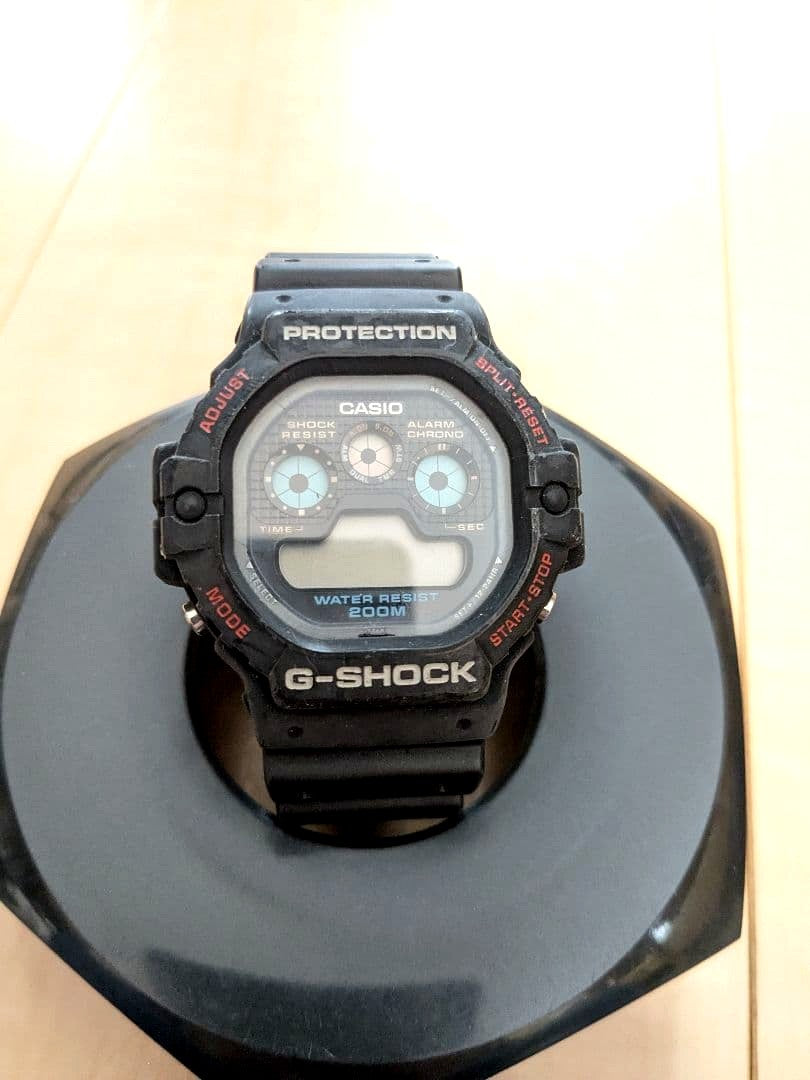 Casio G-Shock DW-5900 digital watch early 1990s model with three digital graphic displays and black resin band