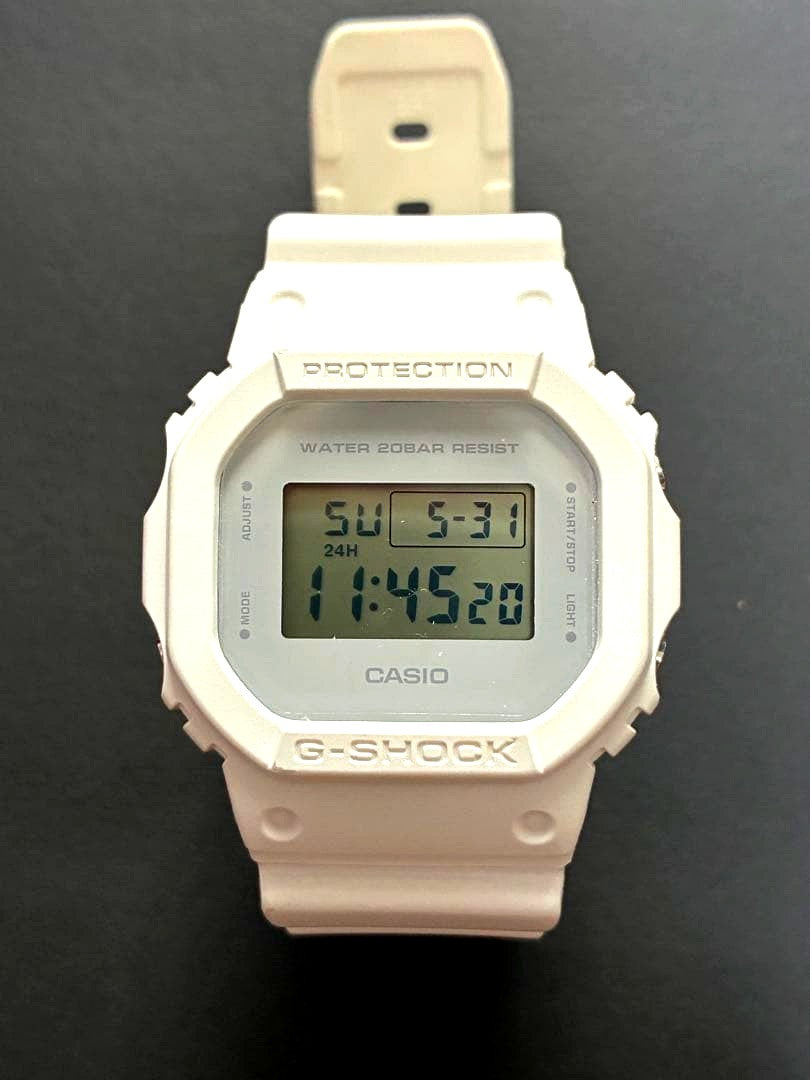 Casio G-Shock DW-5600-MW white digital watch with protective screen film and white resin band