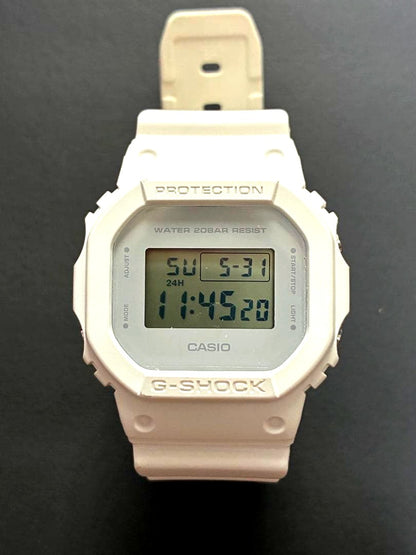Casio G-Shock DW-5600-MW white digital watch with protective screen film and white resin band