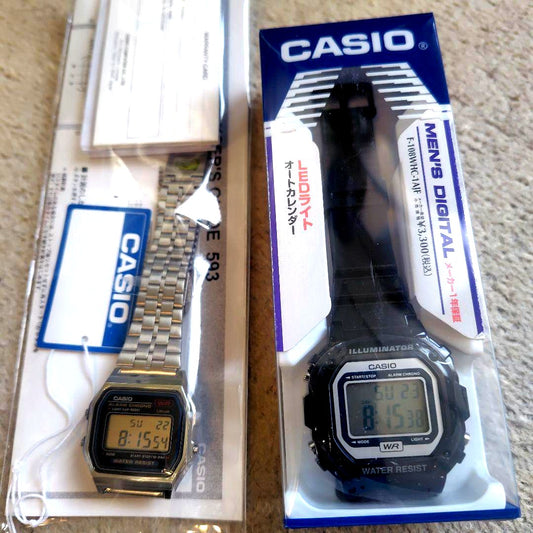 Casio F108 and A159 two-piece watch set with protective films, showing digital watch faces and metal bands.