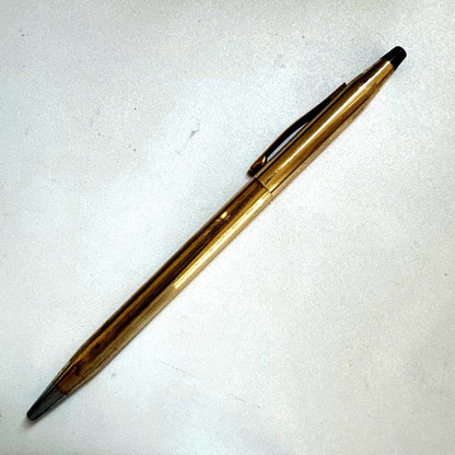 Vintage Cross Classic Century ballpoint pen with 10 karat gold plating on a white background