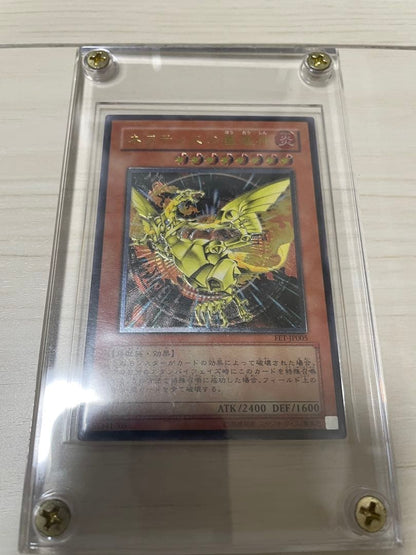 Used Yu-Gi-Oh Nephthys the Phoenix God Ultimate Rare Pleafer Card in screw-down holder with visible scratches and dirt