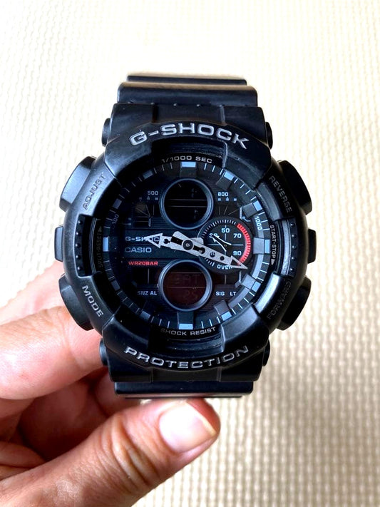 Casio G-Shock GA-140 digital analog watch with black and red design, shock and magnetic resistant